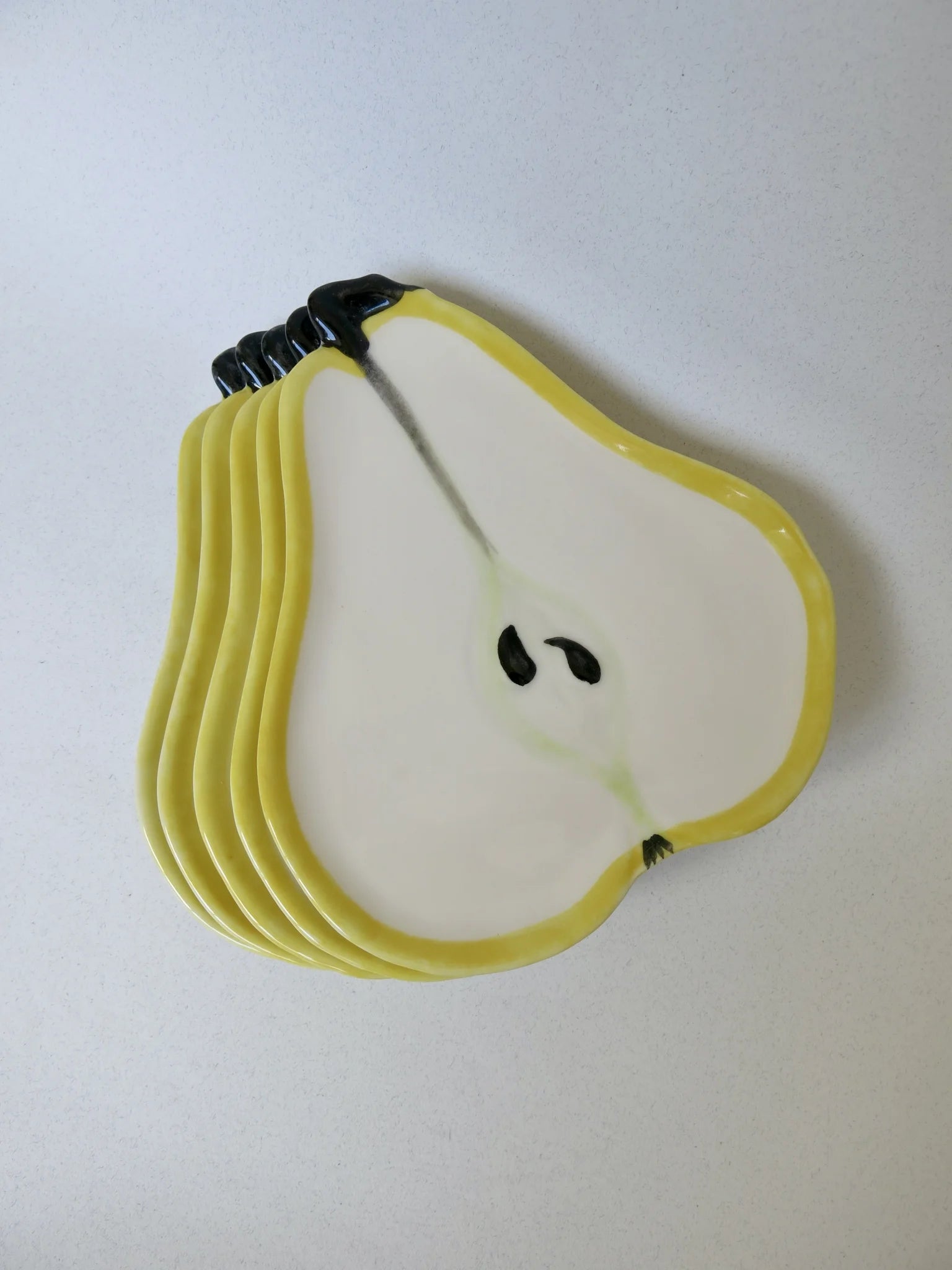 Set piatti M.A.C. a forma di pera – piatti impilati visti dall'alto